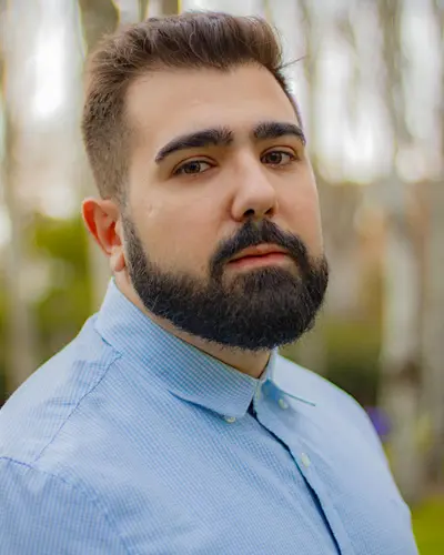 Professional portrait of male principal architect with glasses and suit